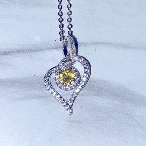 Heart necklace with yellow and clear stones